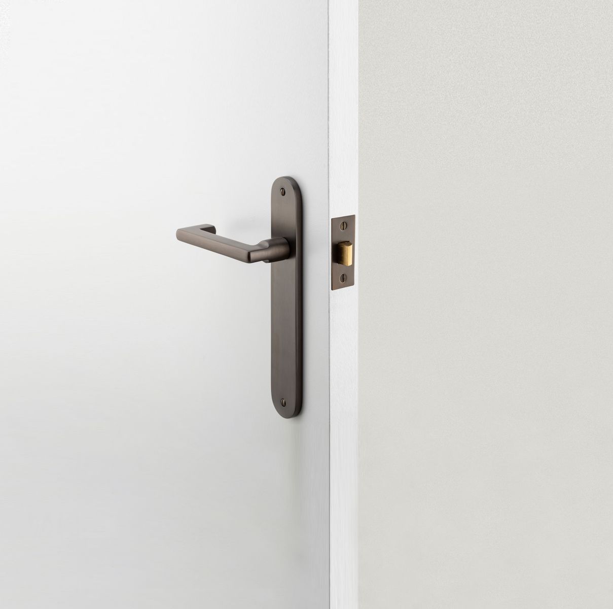 10852 - Baltimore Return Lever - Oval Backplate - Signature Brass - Passage