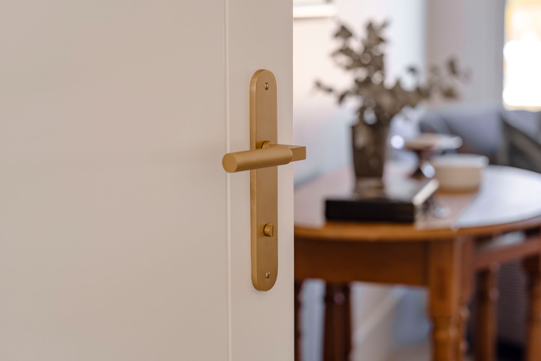 15266P85 - Berlin Lever - Oval Backplate - Brushed Brass - Privacy
