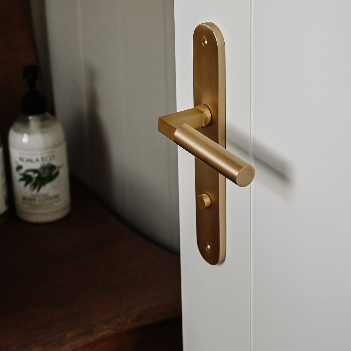 15266P85 - Berlin Lever - Oval Backplate - Brushed Brass - Privacy