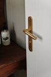 15266P85 - Berlin Lever - Oval Backplate - Brushed Brass - Privacy